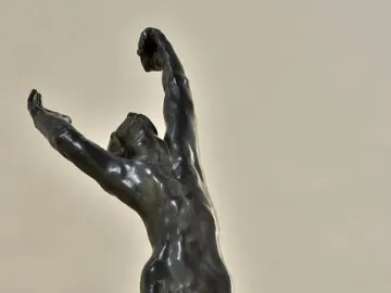 The Prodigal Son by Auguste Rodin, a bronze sculpture of a kneeling nude man with arms raised and head thrown back.