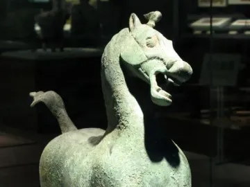 Flying Horse of Gansu bronze sculpture poised on one rear hoof atop a bird figure