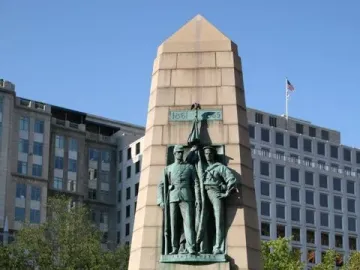 Stephenson Memorial granite monument with bronze figures of a soldier and sailor, a bust, and a flag