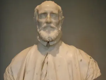 White marble bust of Francesco Barberini with a beard, mustache, and draped cape on a pedestal.