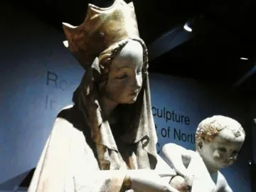 Beautiful Madonna of Wrocław statue of a crowned woman holding a child, with the child grasping a spherical object.