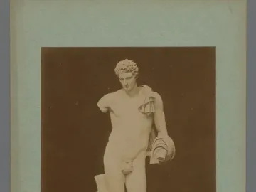Hermes Belvedere, a white marble nude male statue with short curly hair, a draped cloth over one shoulder, and a missing left forearm.