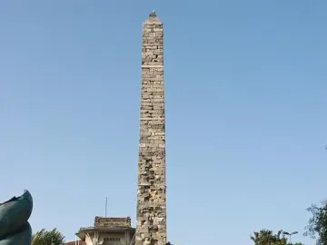 The Serpent Column standing tall against a clear blue sky.