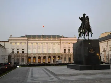 Prince Józef Poniatowski Monument with a bronze equestrian statue before a classical building in Warsaw