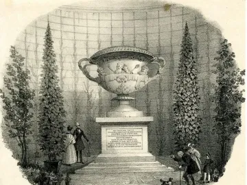 The Warwick Vase displayed on a tall inscribed pedestal in a conservatory, with figures and a small dog at its base.