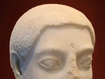 Sabouroff Head, a white marble sculpture of a bearded male head with short textured hair and almond-shaped eyes.