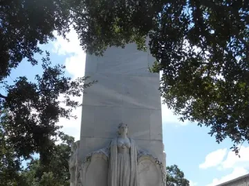 Alamo Cenotaph stone monument with a central relief sculpture and inscriptions on the base.