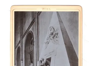 Cenotaph of Archduchess Maria Christina with a white marble pyramid-shaped monument and classical mourning figures.