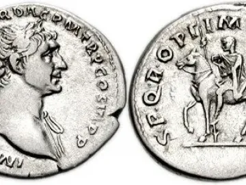 Reverse of a Roman coin showing Trajan’s equestrian statue with a mounted figure holding a spear.