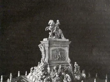Golden Rider equestrian statue model with a rider on a rearing horse atop an ornate pedestal