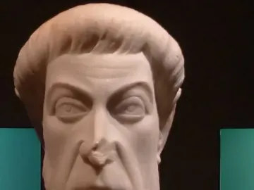 Marble bust of Eutropius with a stern face, short hair, and a short beard.