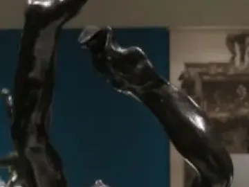 The Prodigal Son bronze sculpture showing a male figure from the waist up with arms raised above his head.