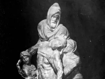 The Deposition sculpture showing a hooded figure supporting the body of Christ, with two draped figures assisting on either side.