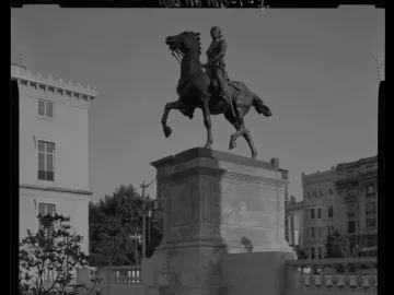 Lafayette Monument with an equestrian statue on a stone pedestal in a paved public space.