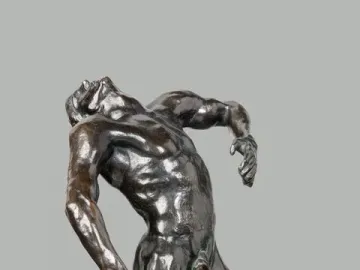 The Falling Man bronze sculpture showing a male figure arching backward on a block-like base.