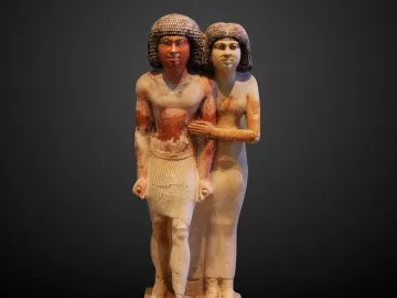 Raherka and Meresankh limestone statue showing a standing Egyptian man and woman together on a base.