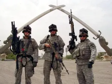 The Victory Arch in Baghdad, two giant crossed swords held by sculpted arms.