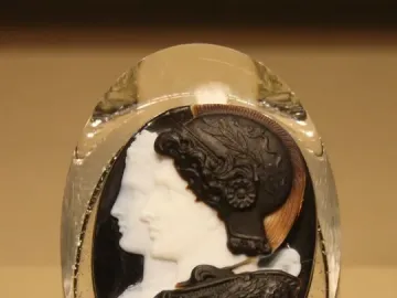 Gonzaga Cameo showing two carved profiles in a layered oval stone, with a helmeted male figure in front of a female profile.