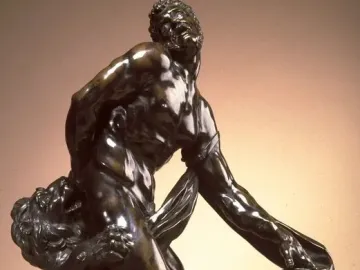 Milo of Croton bronze sculpture of a man struggling as a lion attacks him from behind