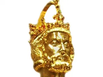 Golden bust of Charlemagne with a crown, beard, and ornate jewel-like decoration.