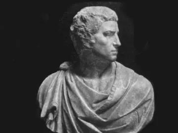 Michelangelo\'s Brutus in marble, shown as a bust with the head turned to the right.