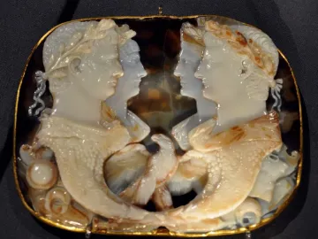 Gemma Claudia cameo with four profile figures in a gold-colored frame