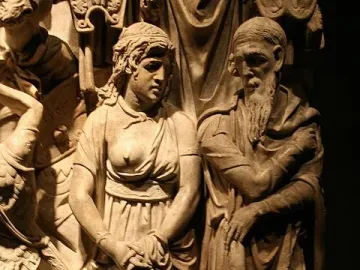 Carved relief on the Portonaccio Sarcophagus showing a draped woman and bearded man among other figures.