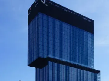 Silesian Insurgents\' Monument in front of modern glass skyscrapers in Katowice