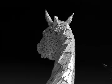 The Kelpies horse head sculpture rising against a dark sky in black and white.