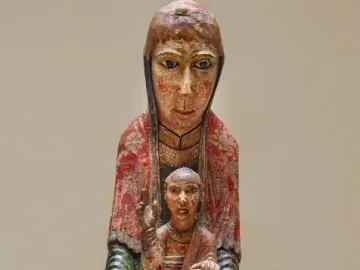Virgin from Ger, a painted wooden Madonna and Child sculpture with faded red and yellow pigments.