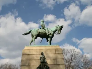 Sherman Monument with a bronze equestrian statue on a tall stone pedestal, flanked by sculptural figures and relief panels.