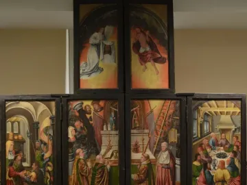 Fisenne Altarpiece with six painted panels in a dark wooden frame