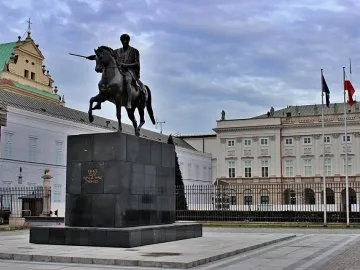 Prince Józef Poniatowski Monument, a dark equestrian statue on a tall stone pedestal in a paved square.