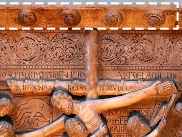 Detail of Benedetto Antelami\'s Descent from the Cross marble relief, showing figures around the cross with an ornate frieze above.