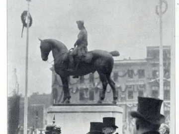 Equestrian Monument of Frederick the Great on a tall pedestal, with formally dressed men gathered in the foreground.