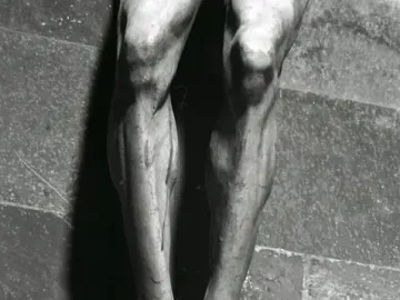 Detail of the Brunelleschi Crucifix showing the carved feet and lower legs of the wooden figure.