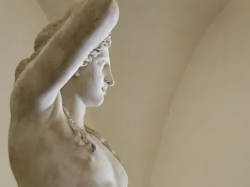Ludovisi Dionysus with a satyr holding out grapes in marble.