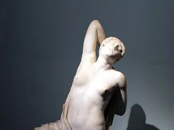 Niobid from the Gardens of Sallust, a white marble statue of a kneeling semi-nude woman with one arm raised behind her head.