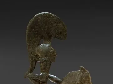 Bronze statuette of the Warrior of Moixent showing a rider on horseback facing right with arms outstretched.