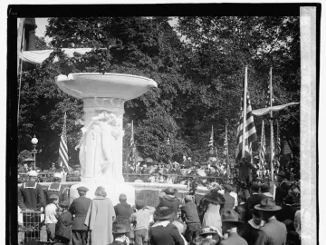 Dupont Circle Fountain with three allegorical sculptures and a crowd gathered for an unveiling ceremony.