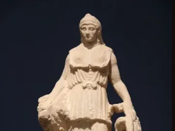 Lenormant Athena, a marble statue of a helmeted draped female figure holding a rounded object and a coiled serpent-like form