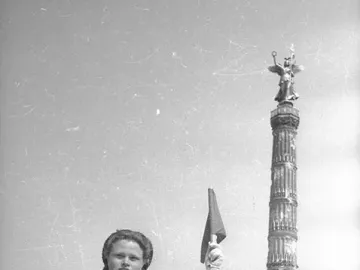 Victory Column with a winged figure holding a wreath and staff atop a fluted column.