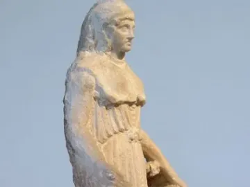 Unfinished marble statuette of the Lenormant Athena with rough chisel marks and draped robes.