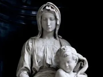 Madonna of Bruges, a white marble sculpture of a seated woman holding a nude child between her knees.