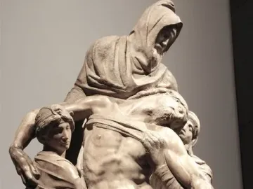 The Deposition marble sculpture showing four figures supporting a limp man.