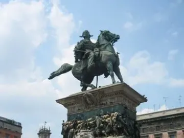 Victor Emmanuel II Monument with an equestrian statue on a marble pedestal and a lion sculpture at the base