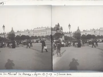 Louis XIV equestrian statue on a pedestal in a busy European city square with crowds and surrounding buildings