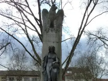 Mutter Kinzig monument with an eagle atop a column and a draped female figure in the fountain base.