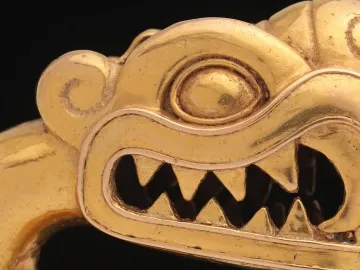 Serpent labret with articulated tongue shown in profile, with a toothed reptile head on a black background.
