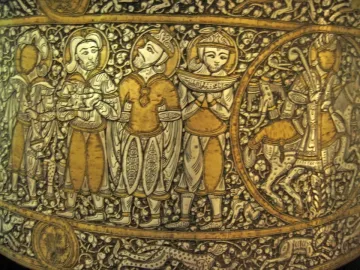 Baptistery of Saint Louis basin with a procession of standing figures and a horseman in a roundel, decorated with gold and silver inlay.